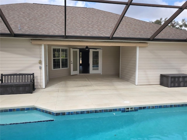 rear view of house with a lanai, ceiling fan, and a patio