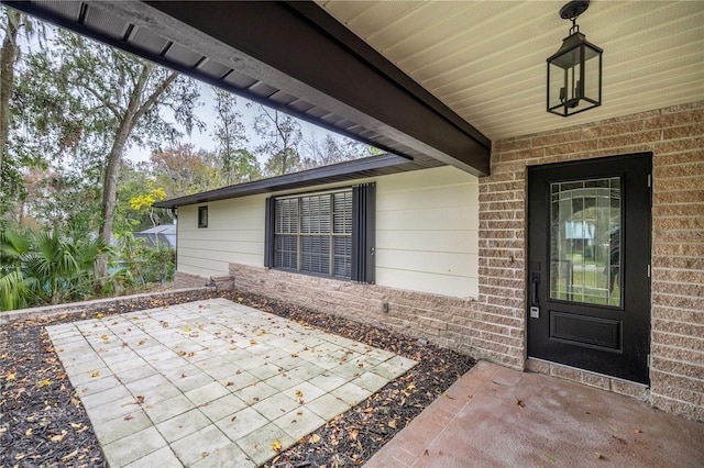 property entrance with a patio