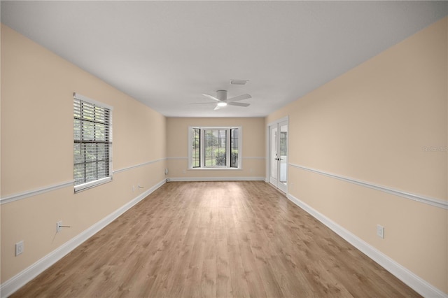 unfurnished room with ceiling fan and light hardwood / wood-style flooring