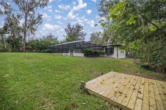 view of yard with a lanai and a deck