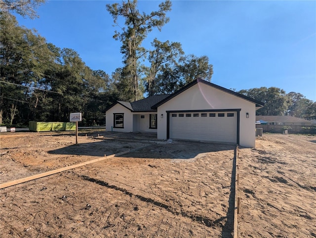 ranch-style house featuring a garage