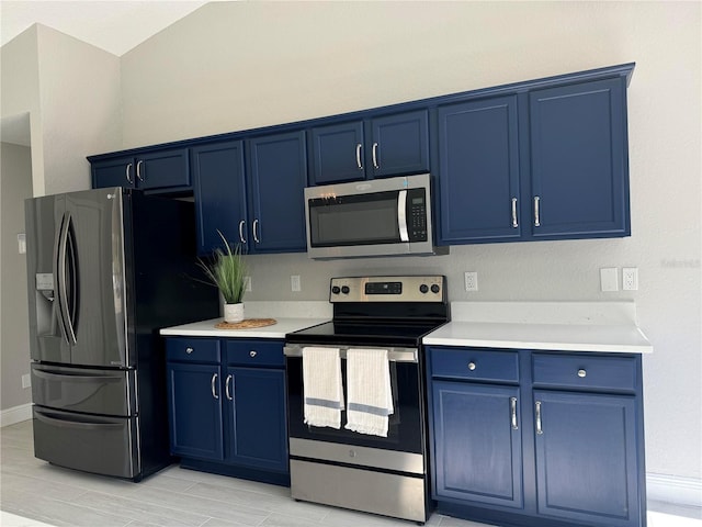 kitchen featuring blue cabinetry and appliances with stainless steel finishes