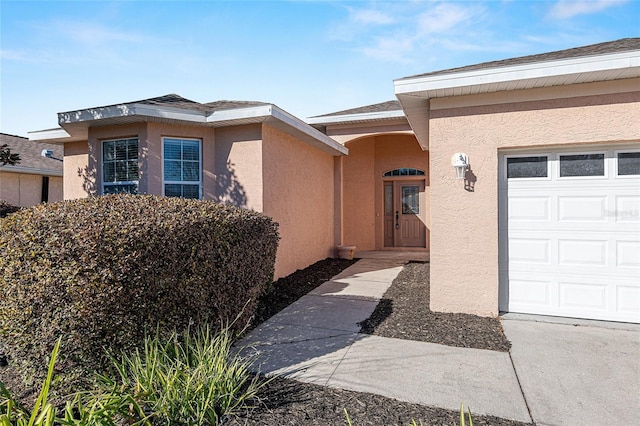 property entrance featuring a garage