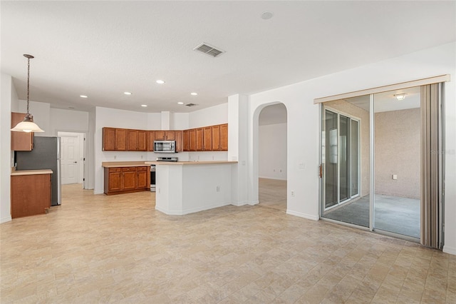 kitchen with decorative light fixtures and stainless steel appliances