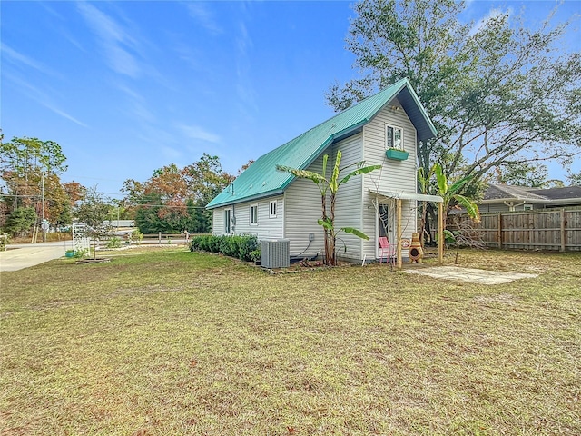 rear view of property with a lawn