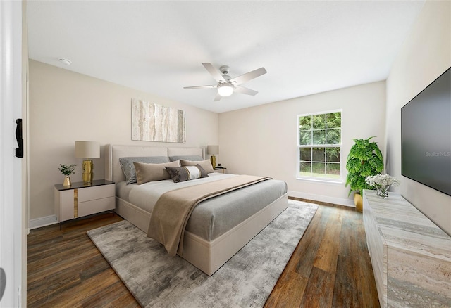 bedroom featuring dark hardwood / wood-style flooring and ceiling fan