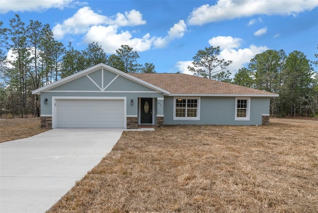 ranch-style house with a garage and a front yard