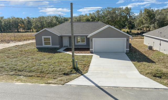 ranch-style house with a front yard and a garage