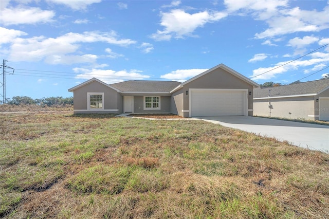 single story home with a front yard and a garage