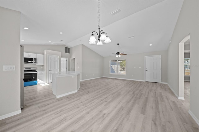 unfurnished living room featuring ceiling fan with notable chandelier, light wood-type flooring, and vaulted ceiling