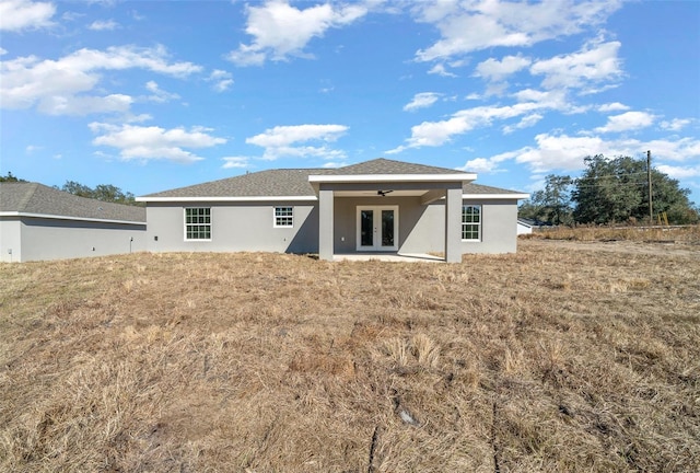 back of house featuring french doors and ceiling fan