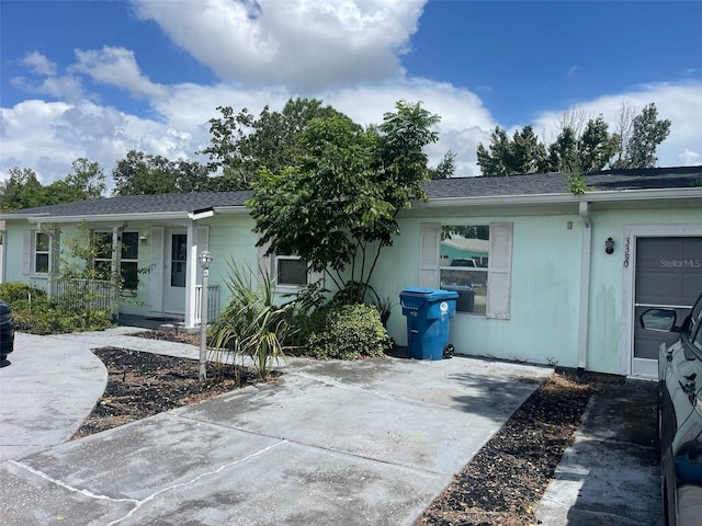 back of property with a porch