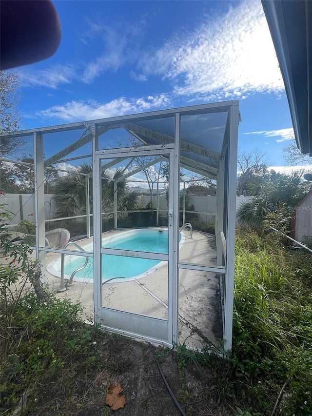 view of pool with a lanai