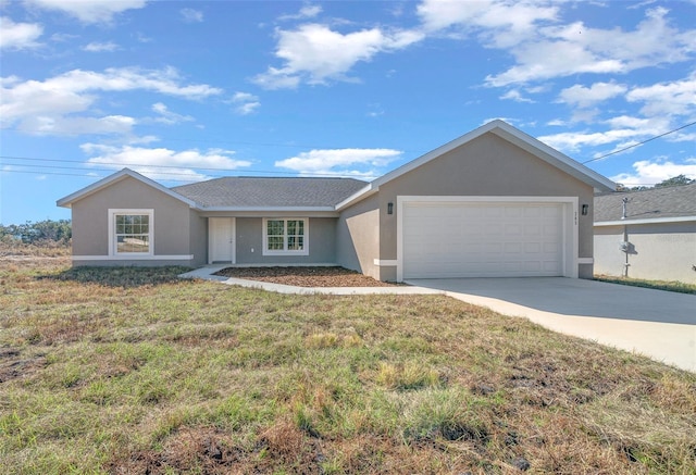 ranch-style house featuring a front lawn and a garage