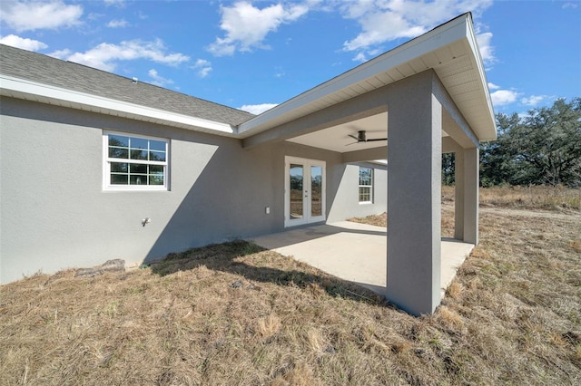 rear view of house featuring a patio area and french doors