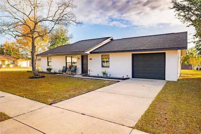 ranch-style home featuring a front lawn, covered porch, and a garage