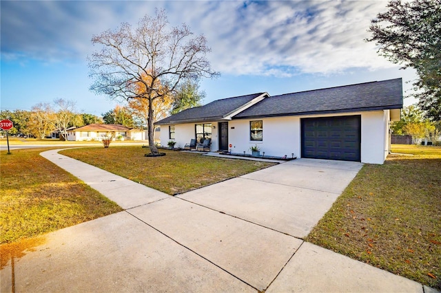 single story home with a front lawn and a garage