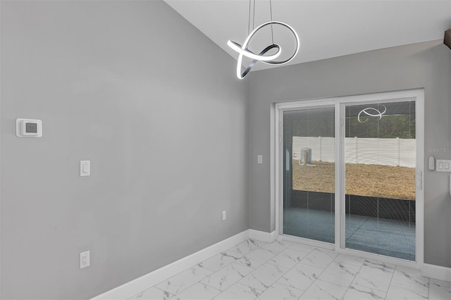 unfurnished dining area with vaulted ceiling