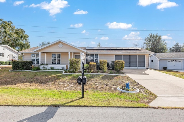 ranch-style house with a garage, a front lawn, solar panels, and a porch