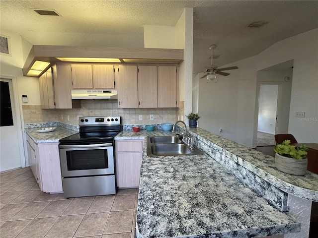 kitchen with under cabinet range hood, stainless steel electric range, light tile patterned floors, and a sink