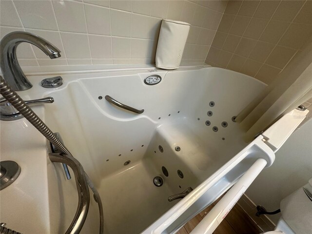 interior details with a tub with jets