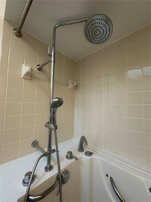 details with a tile shower and a tub