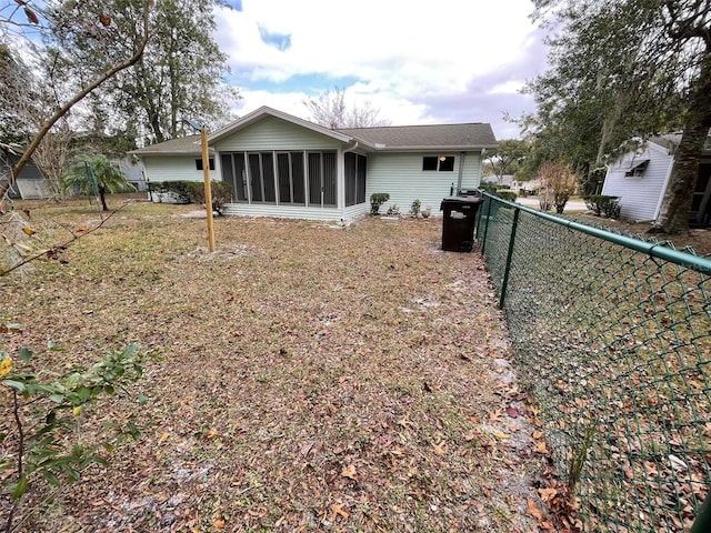 back of house with a sunroom