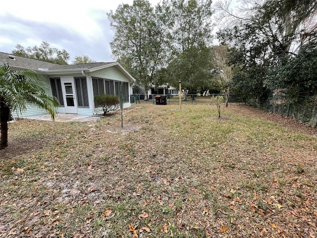 view of yard featuring a sunroom