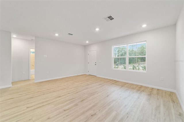 unfurnished room featuring light hardwood / wood-style floors