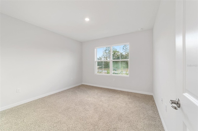 spare room with carpet floors