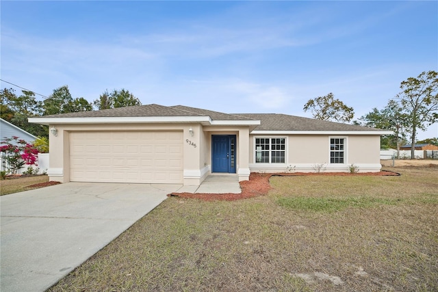 single story home featuring a front yard and a garage