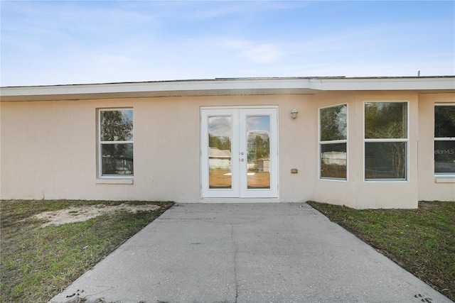 entrance to property with french doors and a patio