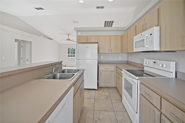 kitchen with white appliances, ceiling fan, sink, light brown cabinets, and lofted ceiling