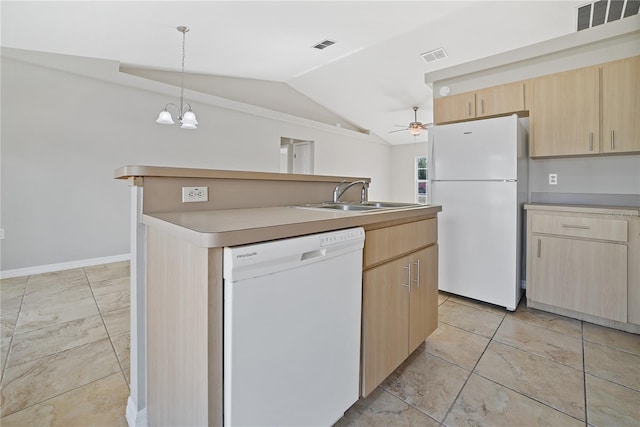 kitchen featuring a center island, light brown cabinets, white appliances, sink, and vaulted ceiling