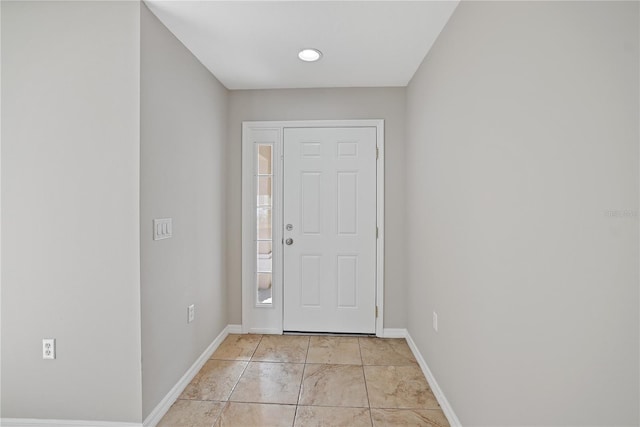 entrance foyer with light tile patterned floors