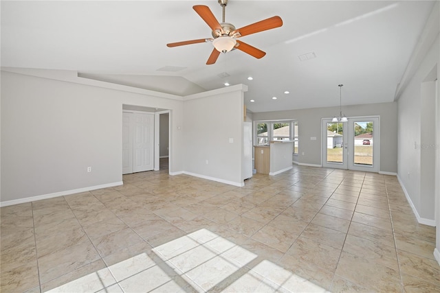 unfurnished living room featuring french doors, ceiling fan with notable chandelier, and vaulted ceiling