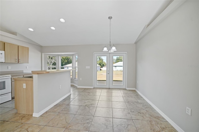 kitchen featuring an inviting chandelier, white appliances, decorative light fixtures, lofted ceiling, and light brown cabinetry