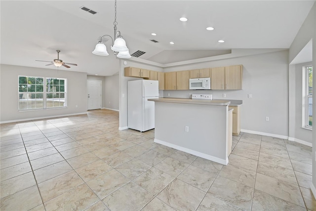 kitchen featuring ceiling fan with notable chandelier, white appliances, a kitchen island, hanging light fixtures, and lofted ceiling