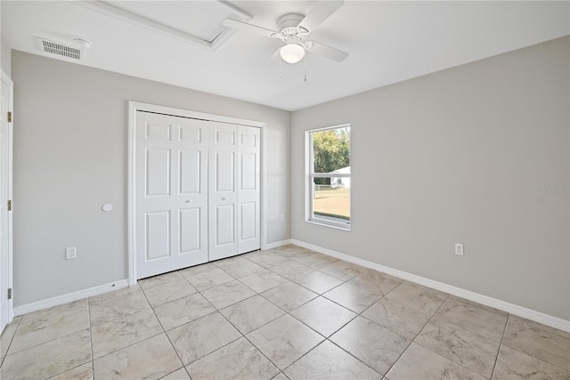 unfurnished bedroom featuring a closet and ceiling fan