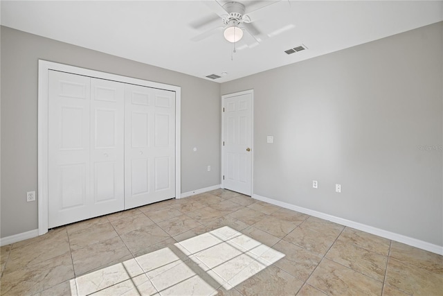 unfurnished bedroom with a closet and ceiling fan