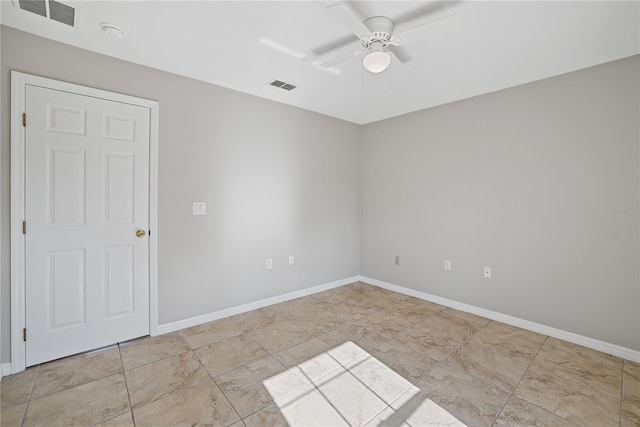 unfurnished room with ceiling fan