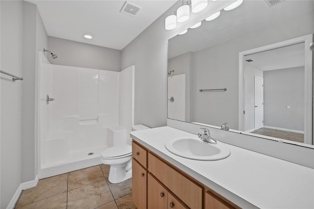 bathroom with tile patterned floors, a shower, vanity, and toilet