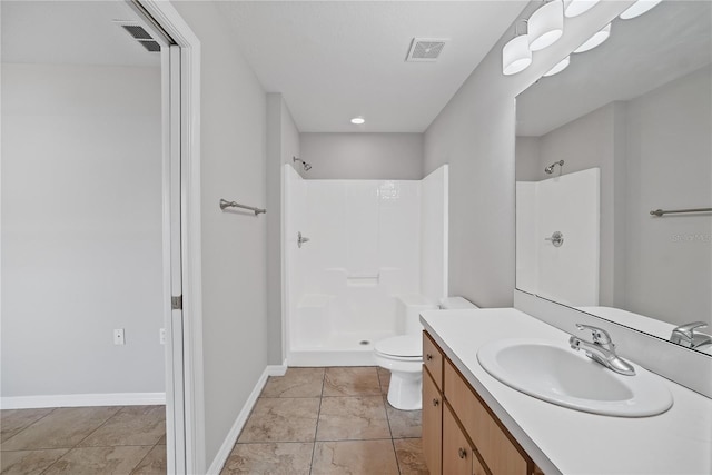 bathroom featuring tile patterned flooring, toilet, a shower, and vanity