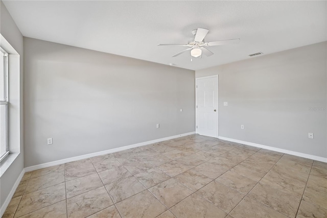 unfurnished room featuring ceiling fan