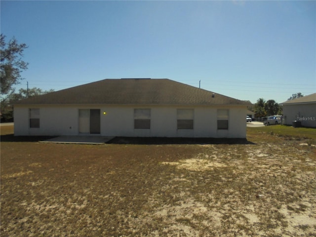 back of property featuring a patio area