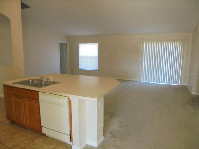 kitchen featuring light colored carpet, vaulted ceiling, a kitchen island with sink, sink, and dishwasher