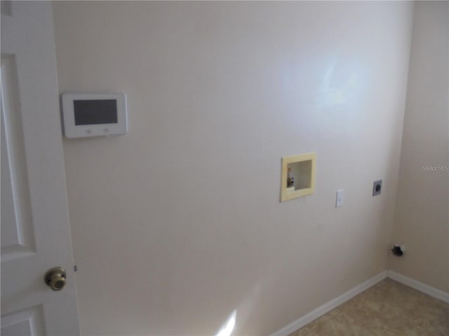 clothes washing area with hookup for an electric dryer and hookup for a washing machine