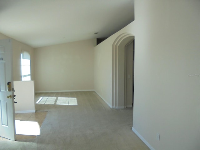 empty room with light colored carpet