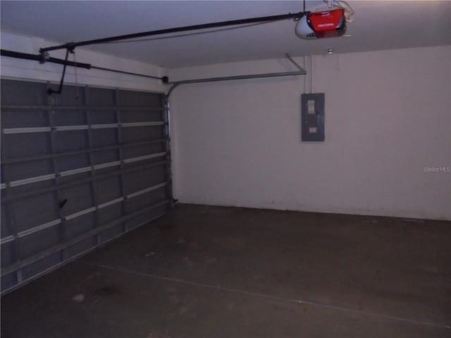 garage featuring electric panel and a garage door opener