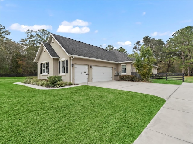 single story home with a front yard and a garage